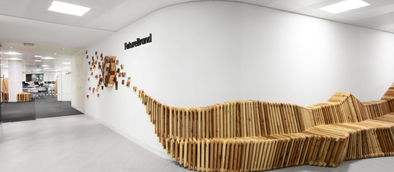 The FutureBrand studio, an open workspace with a sculptural timber installation