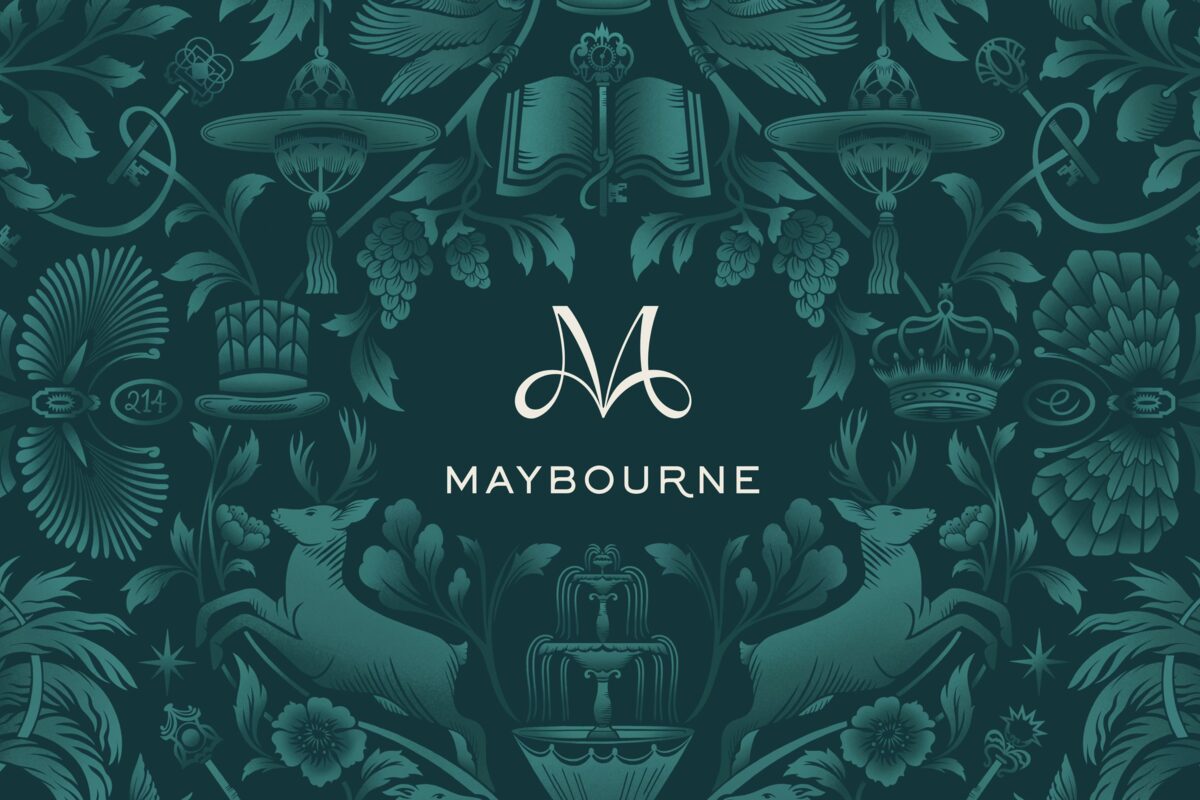 The Maybourne monogram set within an ornate deep-green botanical illustration
